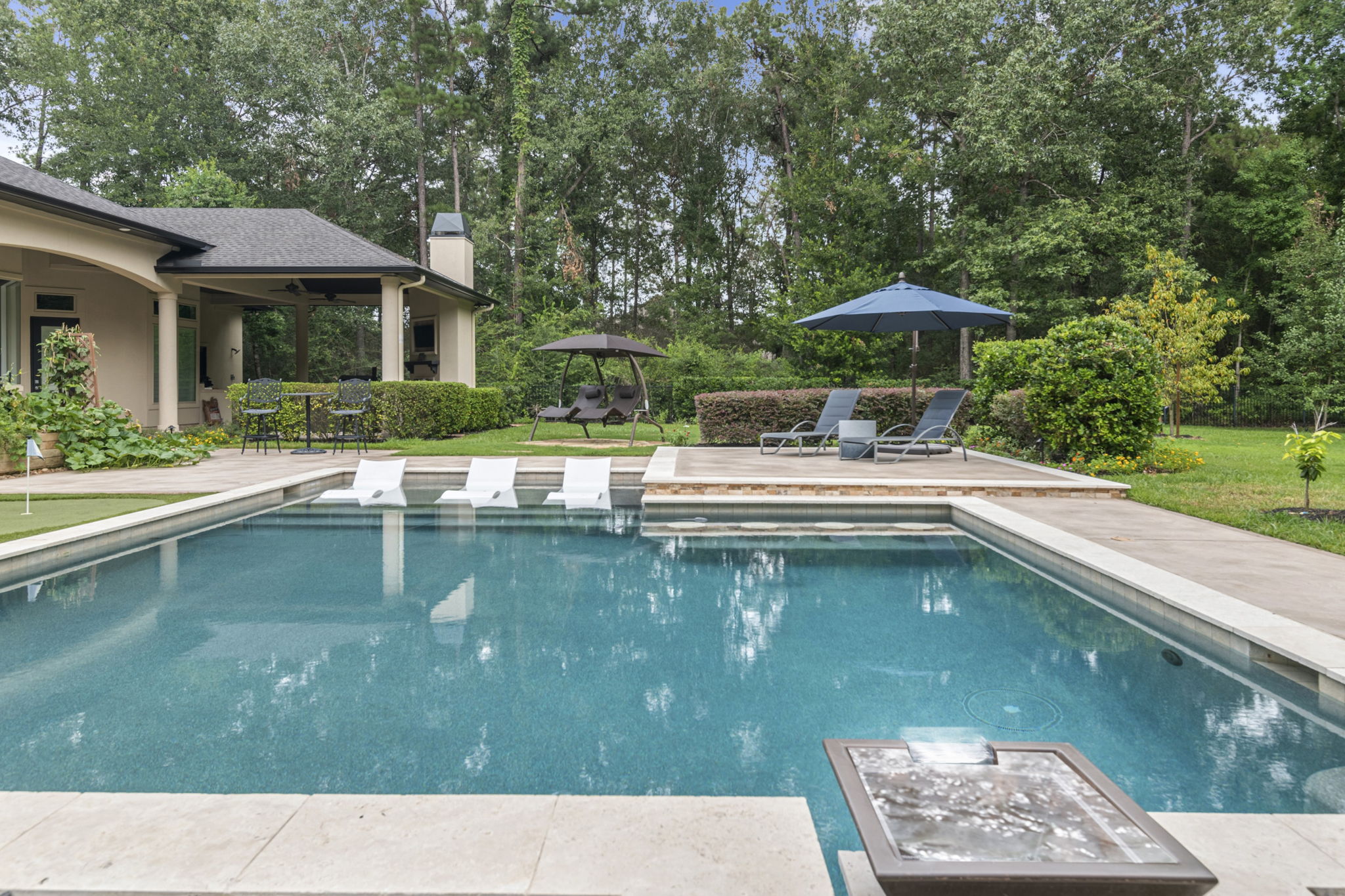 Geometric Pool with Mini Putting Green in Spring TX