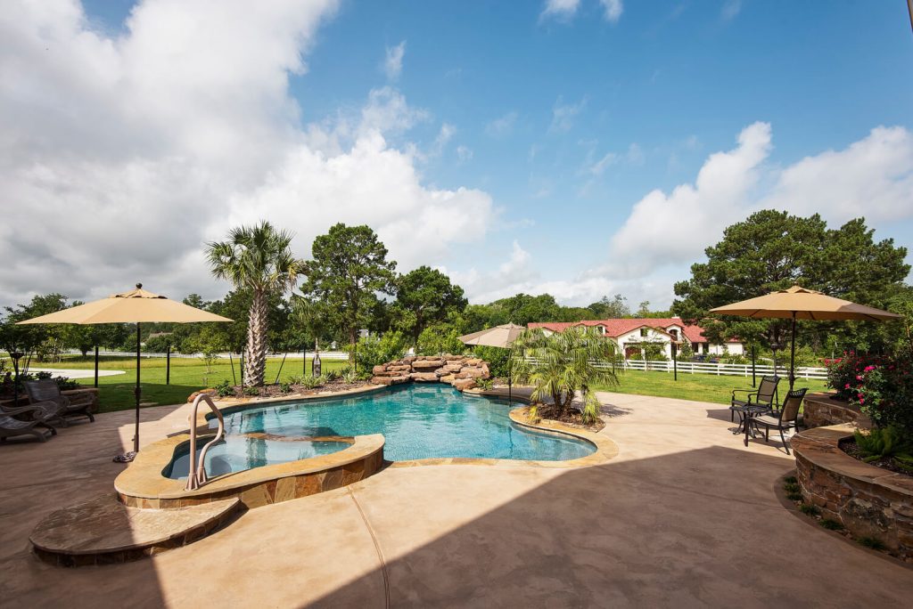 lagoon style custom pool with spa
