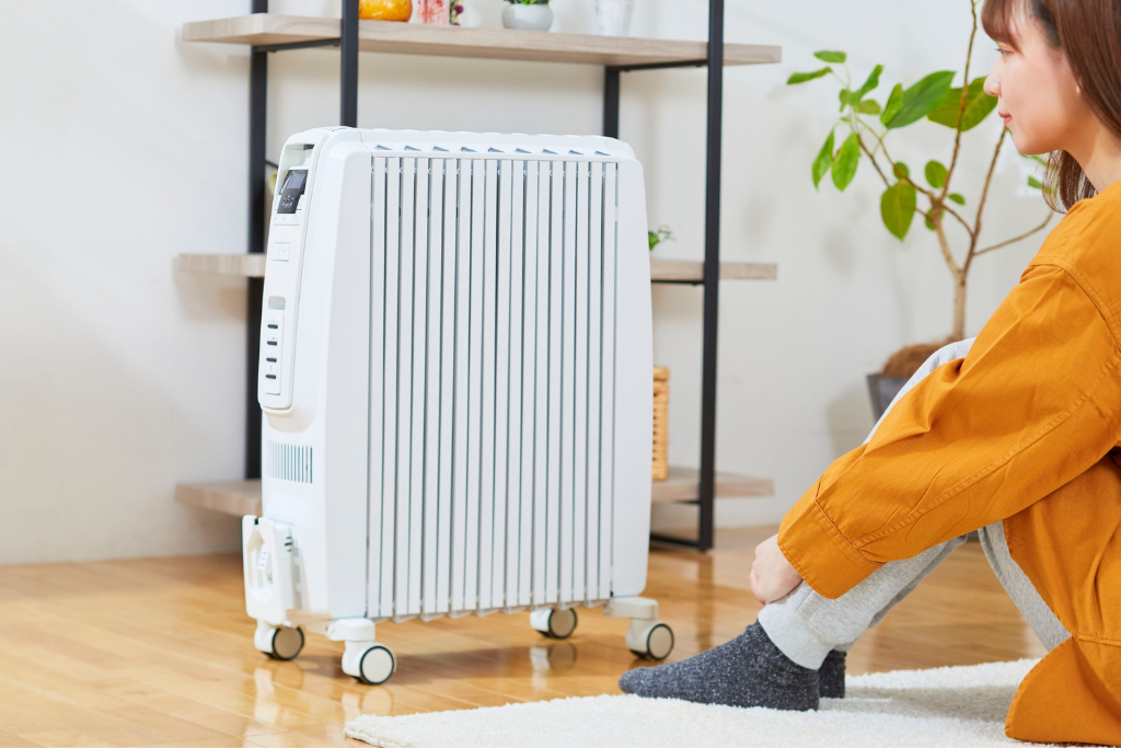person near space heater