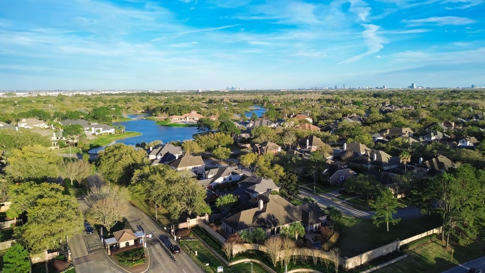 Gated,Community,With,Guard,House,At,Lakeside,Upscale,Residential,Neighborhood houston home builder