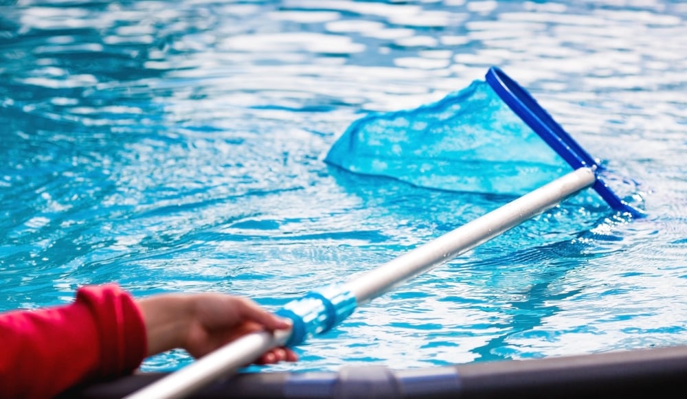 Cleaning,A,Swimming,Pool,With,A,Metal,Frame,With,A